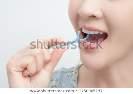 Stock photo: Electric Toothbrush Toothpaste And Dental Floss Isolated On White Background