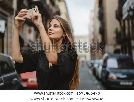 Foto stock: Female Photographer Taking Photos From Her Car