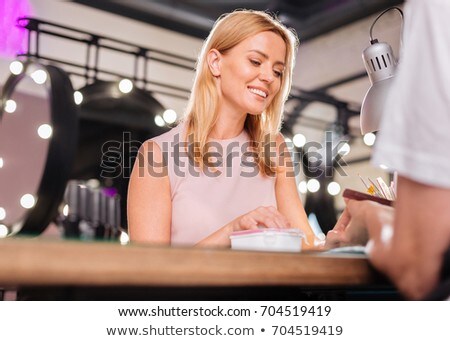 Stock fotó: Elderly Woman Having Her Nails Filed