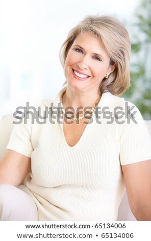 微笑的中年婦女 商業照片 © kurhan
