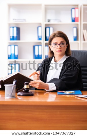 Stockfoto: Middle Aged Female Doctor Working In Courthouse