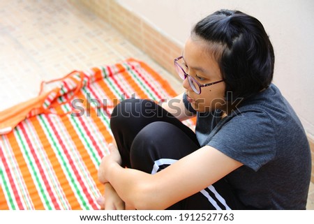 Stockfoto: Sad And Lonely Girl Beside Wall