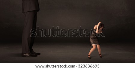 Foto stock: Huge Man With Small Businesswoman Standing At Front Concept