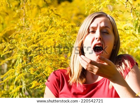 Young Woman Sneezes Because Of An Allergy To Ragweed Stock foto © Barabasa