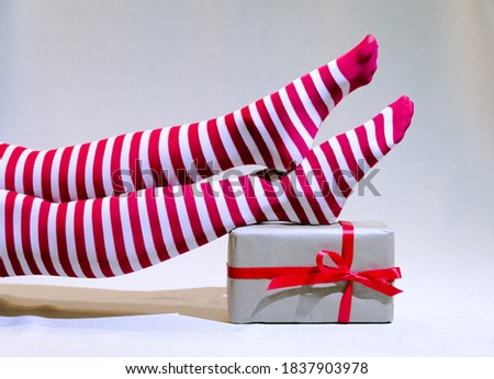 Stockfoto: Gift Boxes With White Stripe And Girls Legs