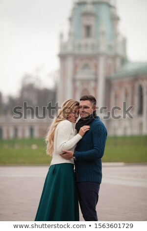 [[stock_photo]]: Adult Man Hugs His Beloved Woman Autumn On A Walk In The City