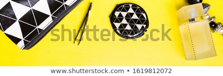 Foto stock: Banner Of Woman Handbag With Makeup And Accessories On Yellow Background Flat Lay