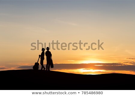 Stock photo: Silhouettes Of Girls With Guitars