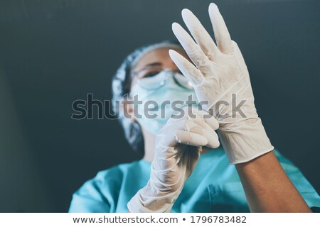 Stock fotó: Female Doctor Or Nurse Wearing Scrubs And Protective Mask And Go