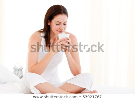Zdjęcia stock: Brunette Woman In Bed Holding Her Hair
