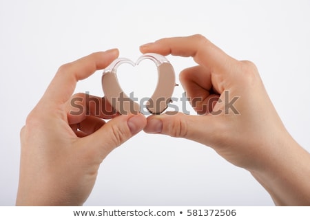 Stockfoto: Showing A Heart Shape From Hearing Aids