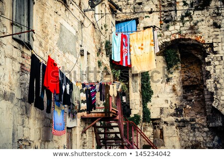 [[stock_photo]]: Scenery In Old Part Of Town Showing Laundry Day