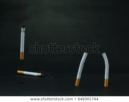 Foto d'archivio: Cigarettes Tied With Rope And Wick