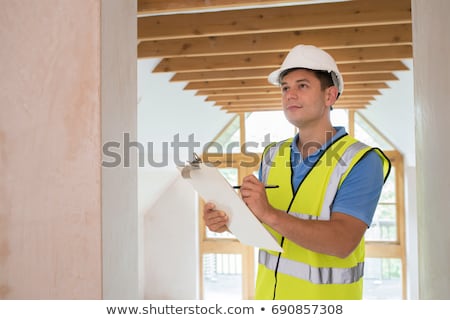 Foto d'archivio: Building Inspector Looking At New Property