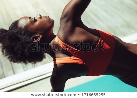 Foto d'archivio: Young African Woman Doing Yoga Exercises