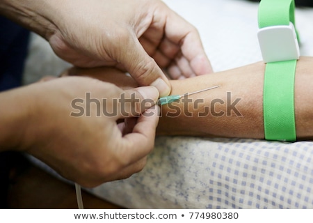 Stok fotoğraf: Iv Drip Inserted In Patients Hand