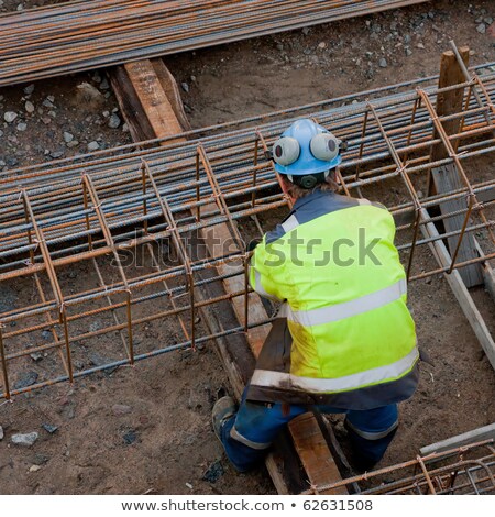Stock photo: Construction Working Assemble Iron Grids Into The Frame Ready For Concrete Work