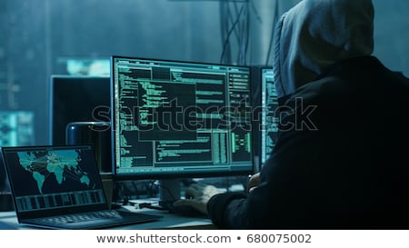 Stok fotoğraf: Hooded Computer Hacker Hacking Network