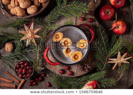 Stock fotó: Christmas Decoration - Apples Pine Branches Walnuts And Floating Candles