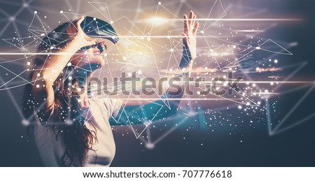 商業照片: Woman Using Virtual Reality Headset