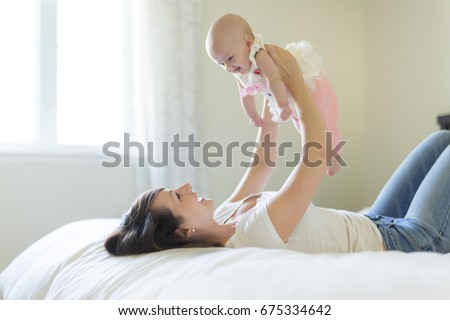 Stock fotó: Portrait Of Mother With Her 3 Month Old Baby In Bedroom