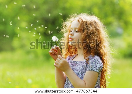 Stock photo: Girl Blowing On Dandelion