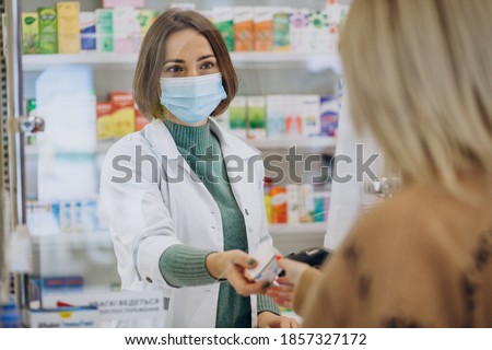 Stock photo: Apothecary And Woman With Drug At Pharmacy