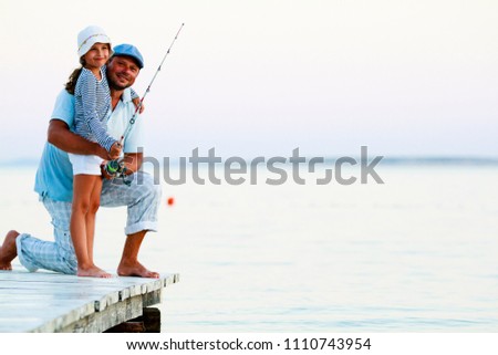 Stock fotó: People At Fishing Pier In Sunset
