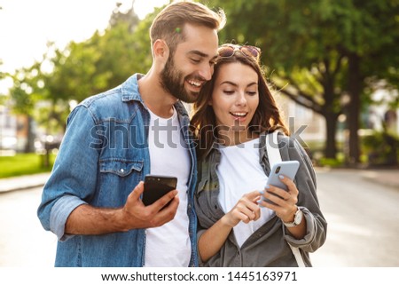 Stockfoto: Couple On The Phone In The Street