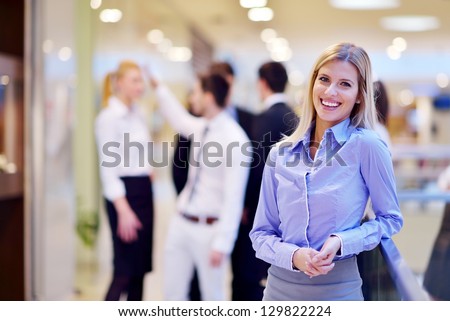 Business Woman With Her Staff In Background At Office [[stock_photo]] © dotshock