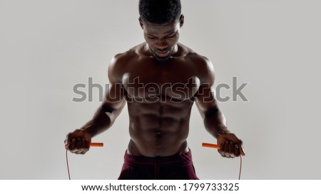 Zdjęcia stock: Young Bodybuilder Doing Jumps Over A Rope