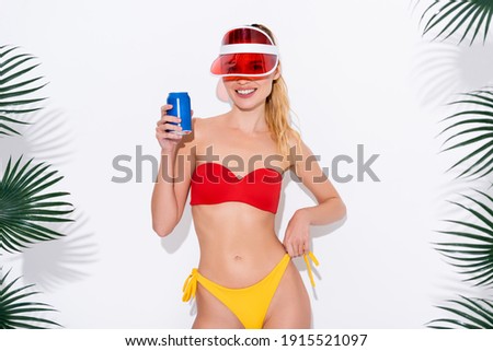 Stockfoto: Happy Woman In Swimwear Drinking Soda Looking Camera