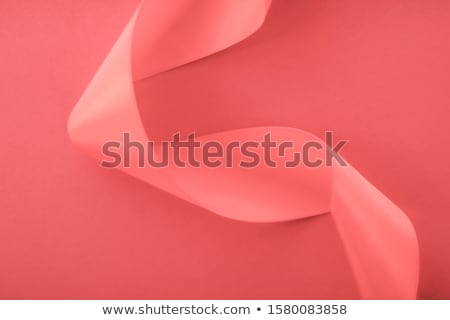 Stock foto: Abstract Curly Silk Ribbon On Coral Background Exclusive Luxury