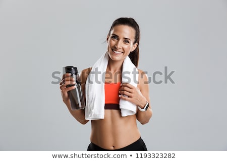 Сток-фото: итнес · - · молодая · спортивная · женщина · с · водой · и · полотенцем