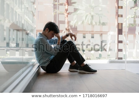 Foto stock: Man With Headache Holding Head In Pain