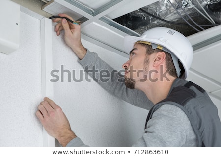 Сток-фото: Man Concealing Wiring