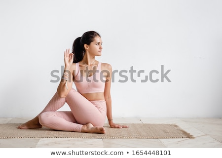 Foto d'archivio: Young Attractive Woman Doing Pilates