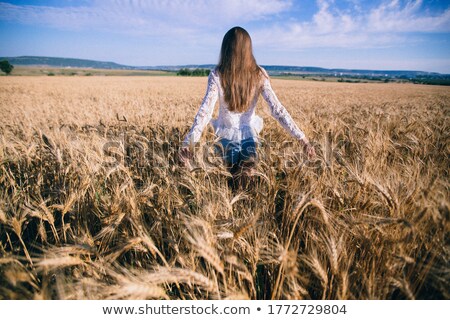 Zdjęcia stock: Girl Standing In Tall Grassy Field