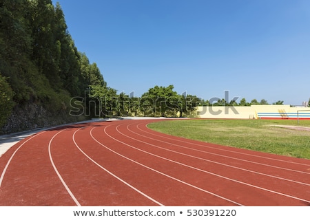 Foto stock: Running Track Under Blue Sky