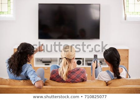 Stock photo: Group Of Three Girls Watching Tv