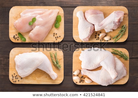 Foto stock: Raw Uncooked Chicken Legs Drumsticks On Wooden Board Meat With Ingredients For Cooking Top View