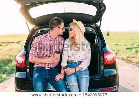 Stockfoto: Traveler With Coffee In Retro Minivan