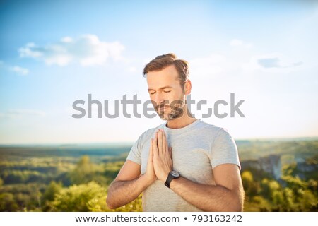 Zdjęcia stock: Bearded Man Meditating With A Serene Expression
