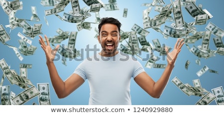 Foto stock: Indian Man Celebrating Triumph Over Money Falling