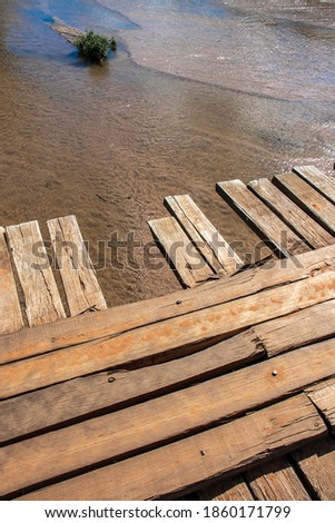 Foto stock: Wooden Floors Over The River In The Wild