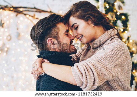 Stockfoto: Romantic Couple In Love Feeling Happiness About Their Romance Spending Christmas Eve Together