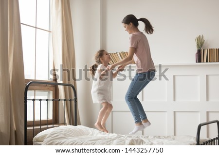 Сток-фото: Mother With Baby On Bed Having Good Time