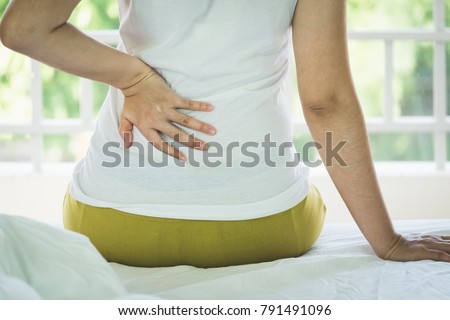 Stock fotó: Woman Massaging Lower Pain Back Isolated On White Background