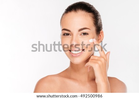 Zdjęcia stock: Young Woman Preparing For Facial Treatment Isolated On White