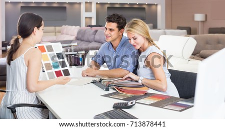 Сток-фото: Young Woman Shopping For Furniture In A Furniture Store